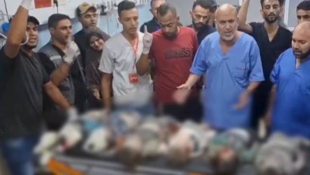 Həkim hücumlarda həyatını itirən uşaqların cənazələri önündə dünyaya səsləndi