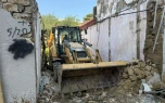 “Sovetski”də qəzalı binalar sökülür