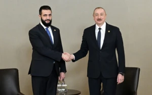 İlham Əliyev Suriyanın keçid dövrü Prezidenti ilə görüşdü